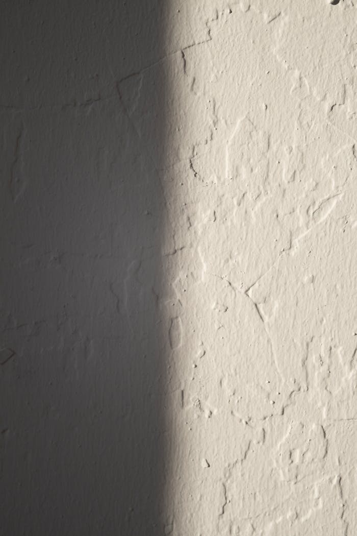 Rough concrete wall of white color